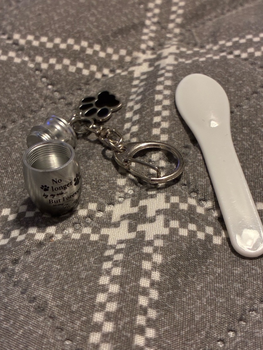 Silver Pet Memorial Keychain with Paw Charm and Black Pet Memorial Keychain.